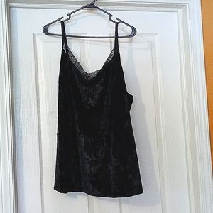 A spaghetti strap black velvet top.